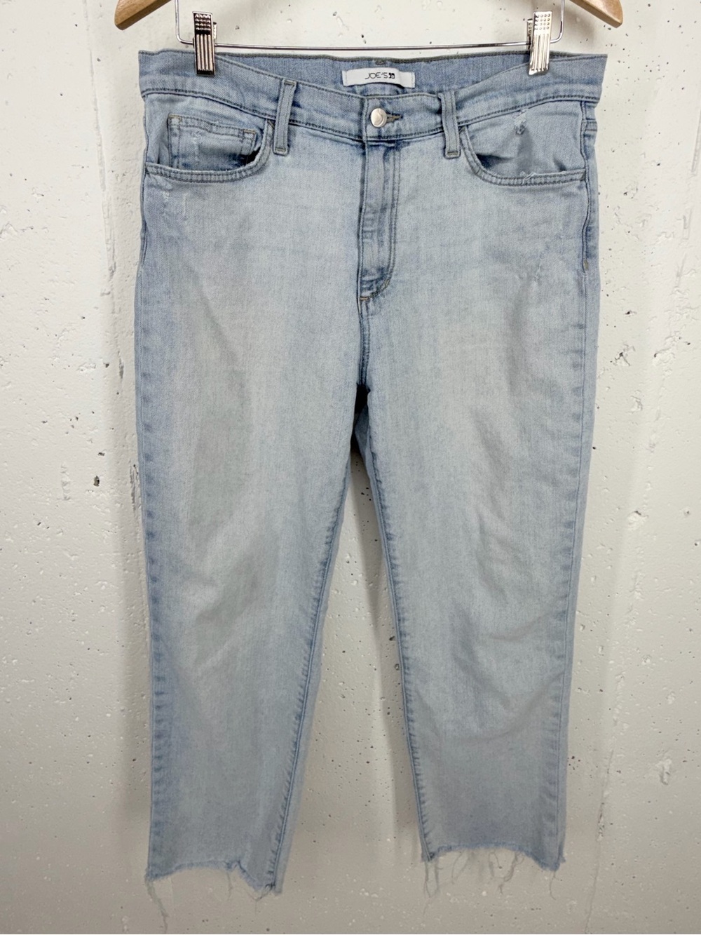Joe's Jeans Women's size 31 light wash jeans featuring a slim fit and raw hem
